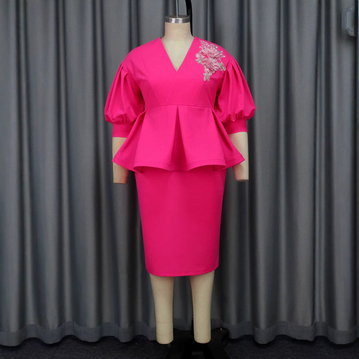 Modisches Damen A-Linien Abendkleid mit markanten Puffärmeln und detailreichem floralem Design, sehr weiblich.