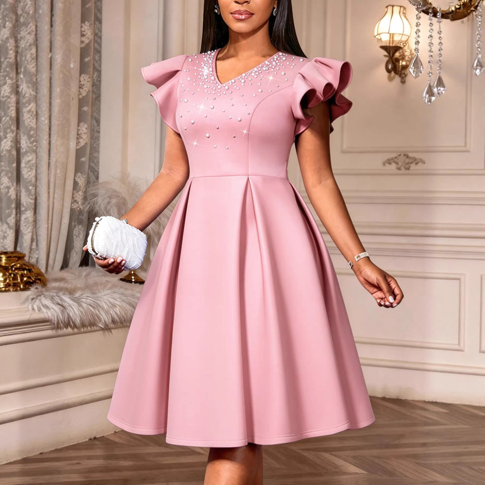 Glamouröses Strasskleid für Damen mit funkelnden Details und voluminösen Ärmeln, ideal als Partykleid.