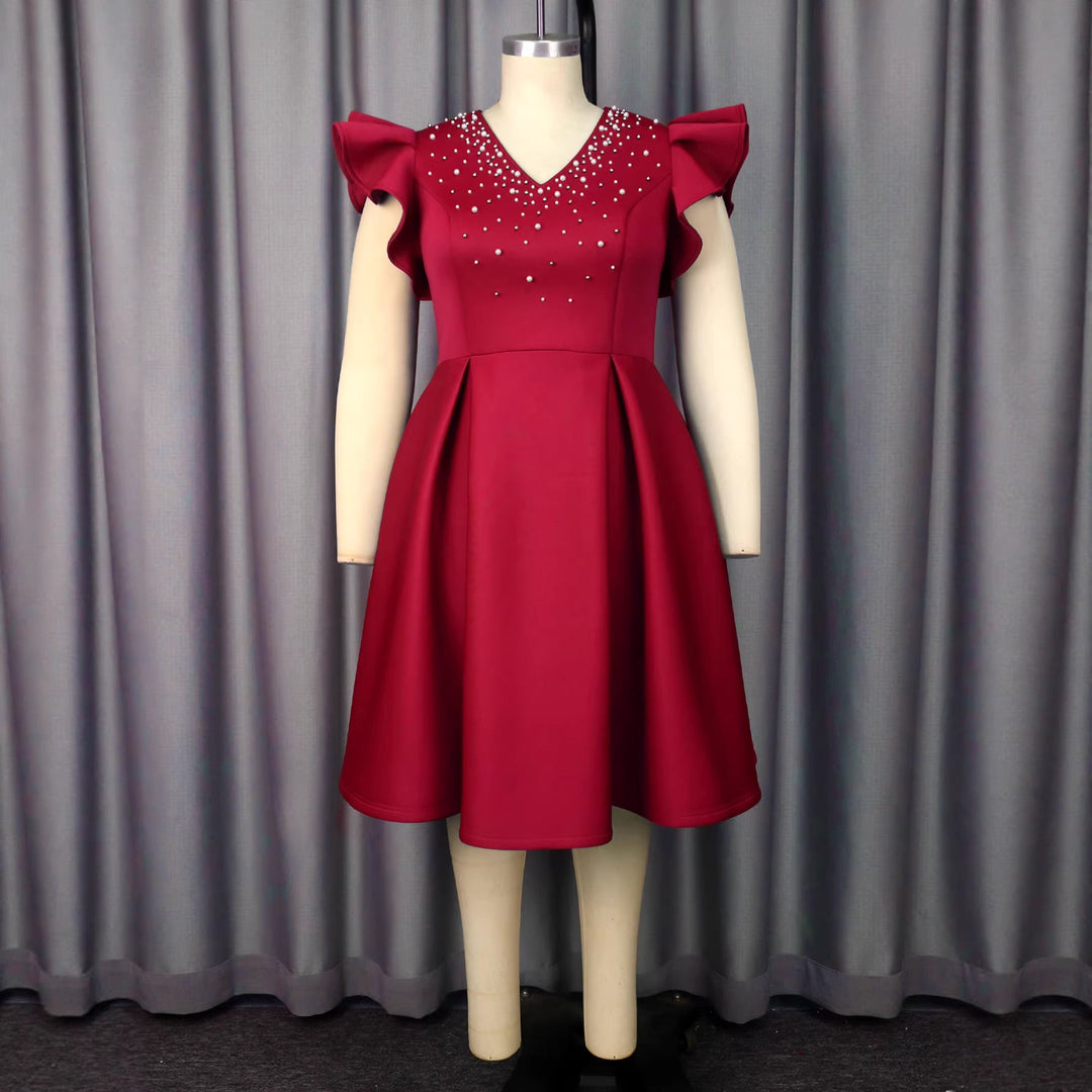 Chices Cocktailkleid für Damen, figurschmeichelnd mit Strass und eleganten Volantärmeln für besondere Abende.