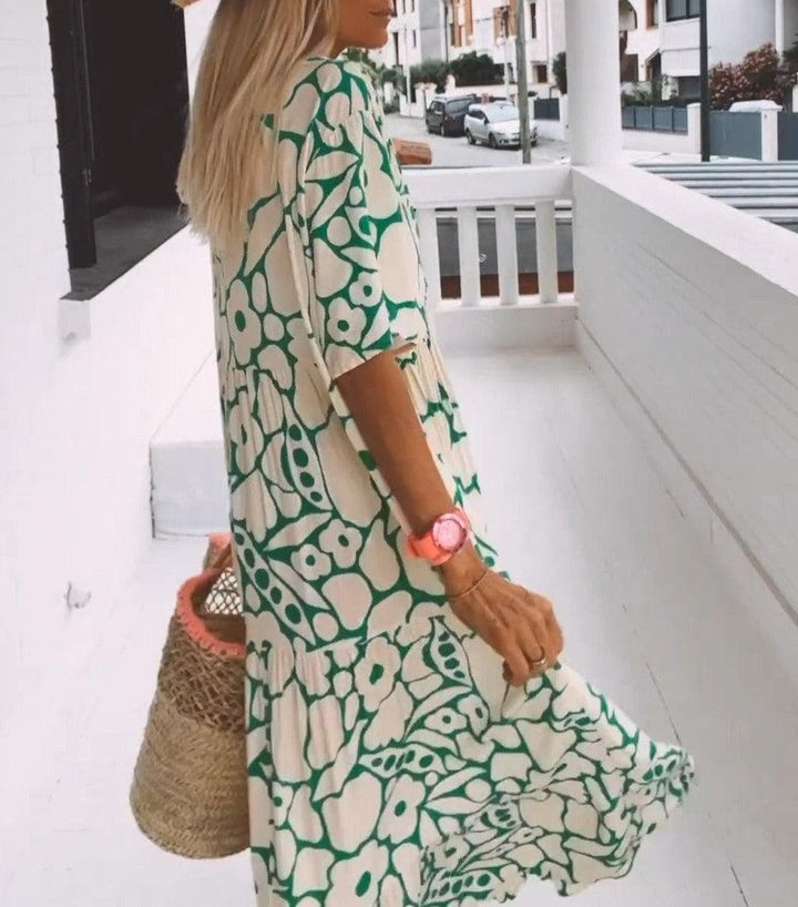 Elegantes Damen Blumen Maxikleid mit V-Ausschnitt & Flügelärmeln. Leichtes Sommerkleid für Freizeit & Urlaub.