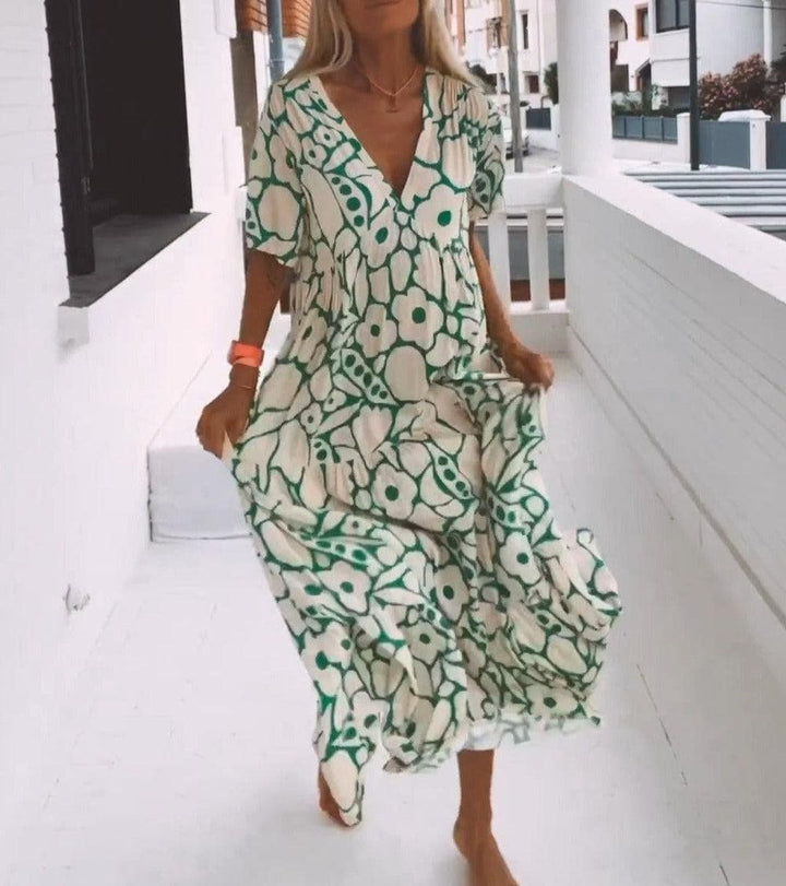 Luftiges Damen Blumen Maxikleid, ideal als Sommerkleid & Freizeitkleid. Mit elegantem V-Ausschnitt.