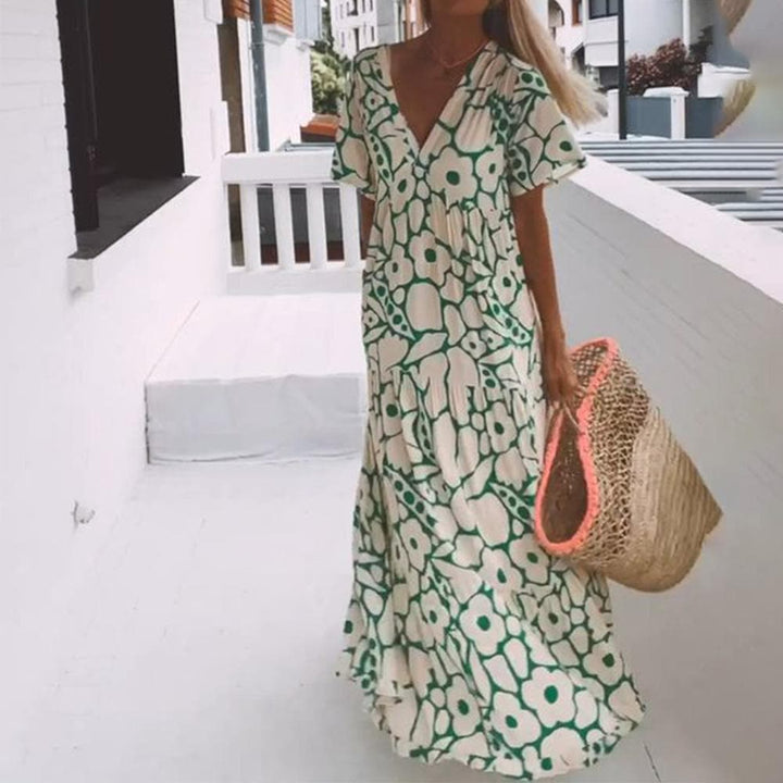 Damen Sommer Maxikleid mit lebhaftem Blumenmuster. Leichtes, elegantes Kleid für Strand, Urlaub oder Freizeit.