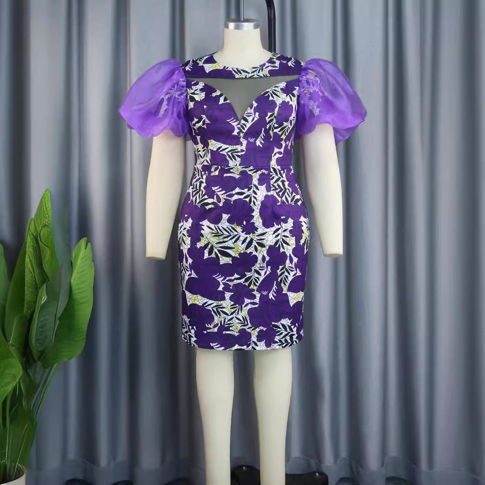 Festliches Partykleid für Damen, lila mit Blumenmuster & eleganten Puffärmeln, perfekt für besondere Anlässe.