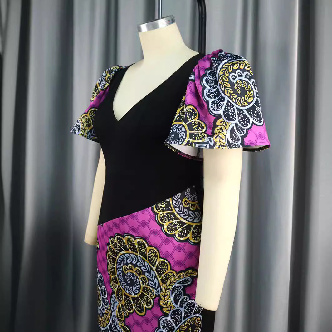 Elegantes Sommerkleid mit buntem Mustermix, femininen Puffärmeln. Bequemes und modisches Etuikleid für Partys.