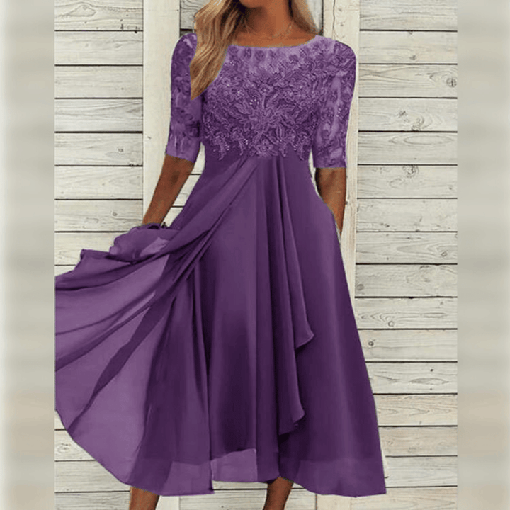 Stilvolles knielanges Damenkleid mit halblangen Ärmeln. Modisches Herbstkleid für Frauen, elegant & bequem.