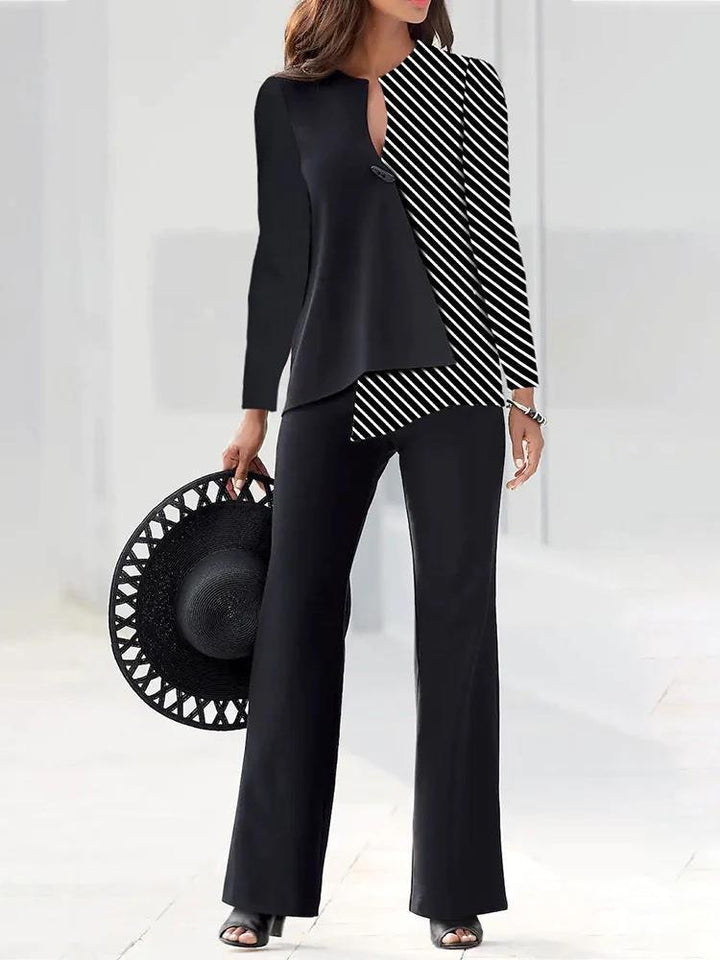 Hochwertiges Damen Hosenanzug Set: moderner Zweiteiler mit asymmetrischer Bluse und eleganter Stoffqualität.