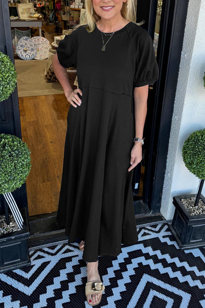 Modisches Damen Maxikleid in eleganter Passform, mit stilvollen Puffärmeln und klassischem Rundhalsausschnitt.