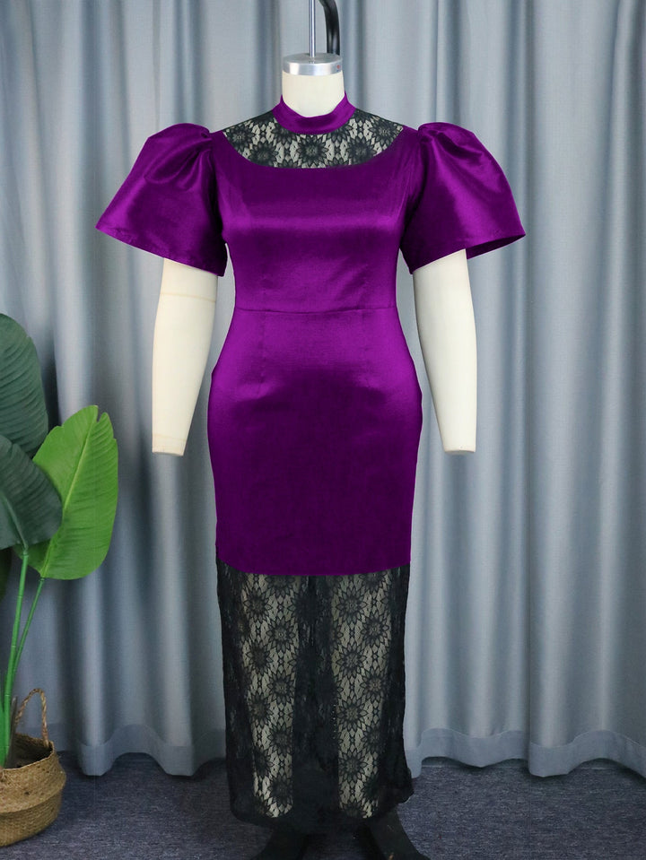 Exquisites Damen Abendkleid in Maxi-Länge, verziert mit Spitze und eleganten Puffärmeln.
