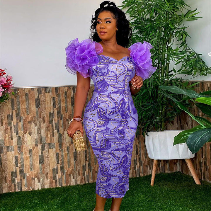 Elegantes Damen Midi-Kleid mit Kunstdruck & modischen Puffärmeln. Perfekt für besondere Anlässe im Frühling.
