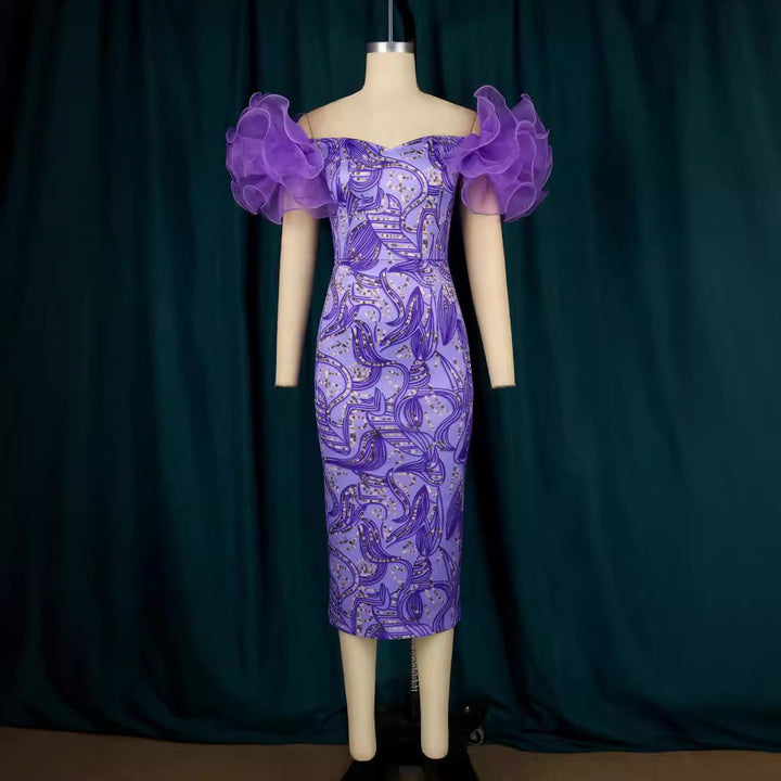Stilvolles bedrucktes Midi-Kleid für Damen, ideal für Frühling & Sommer, mit schicken Puffärmeln. Sehr elegant.