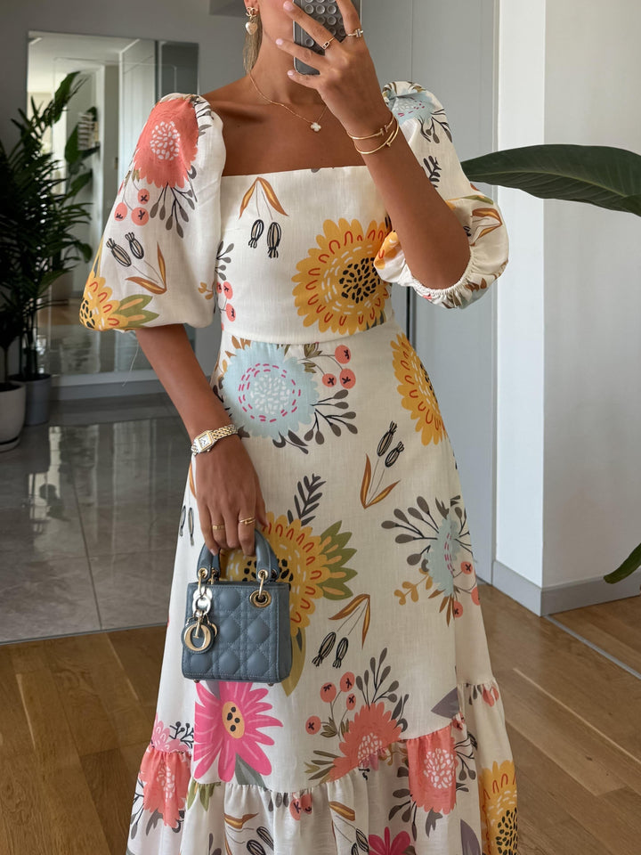 Romantisches, schmeichelhaftes Damen Midi Kleid mit eleganten Puffärmeln. Ideal für besondere Anlässe.