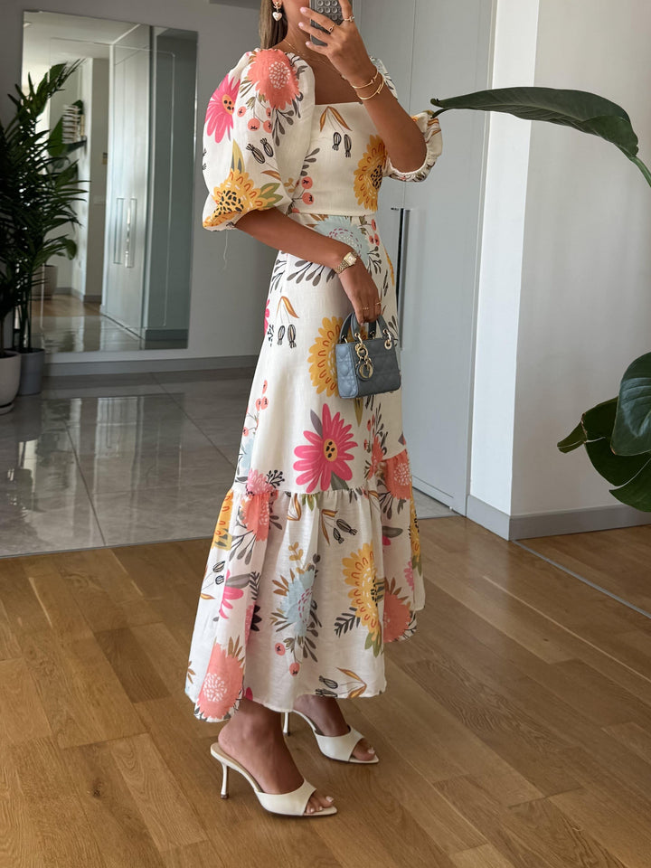 Stilvolles Damen Sommer Midi Kleid mit Puffärmeln. Vielseitig kombinierbar als Freizeit- oder Abendkleid.