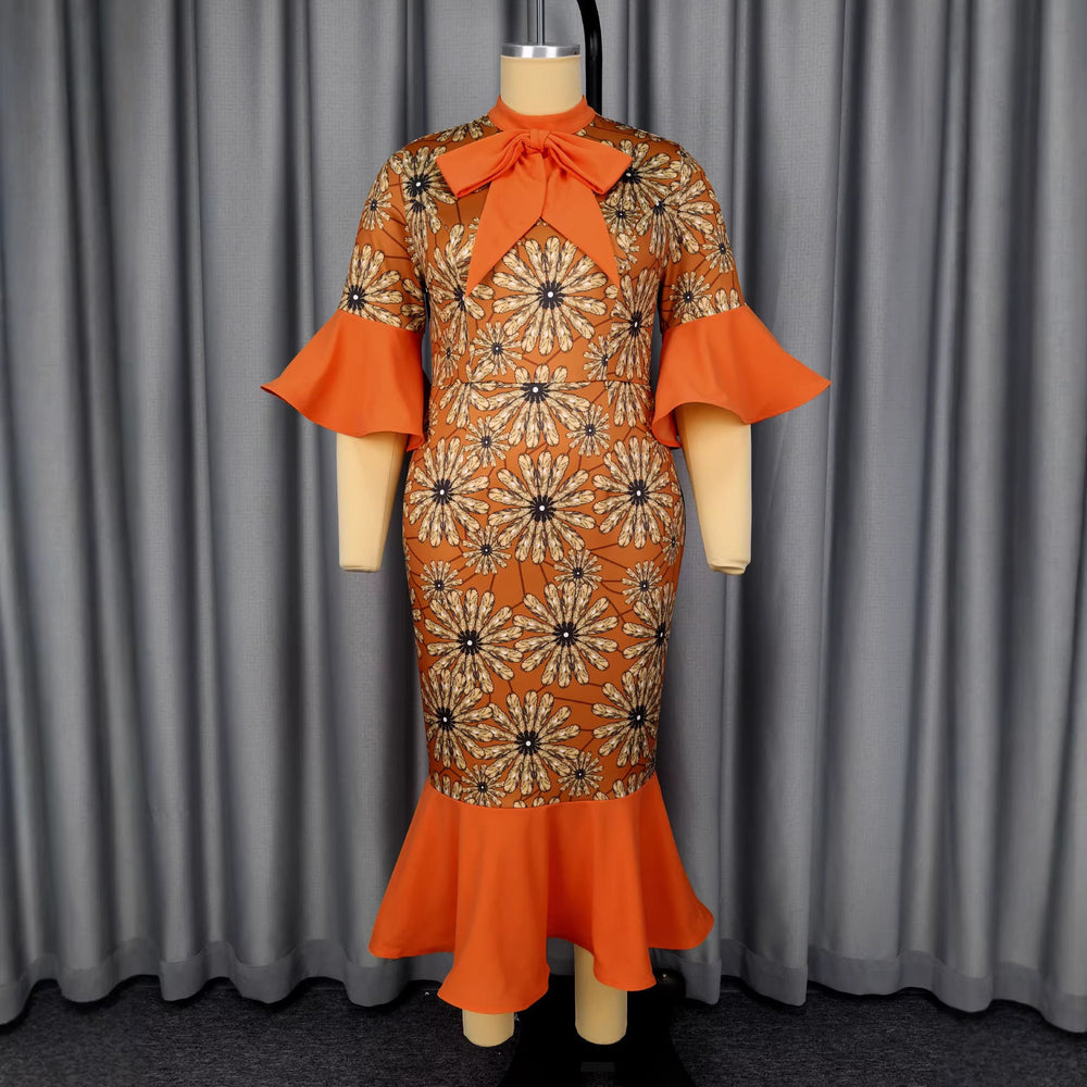 Oranges Langarm-Midikleid für Damen mit zartem Blumenmuster und elegantem Schleifenkragen, ideal für Partys.