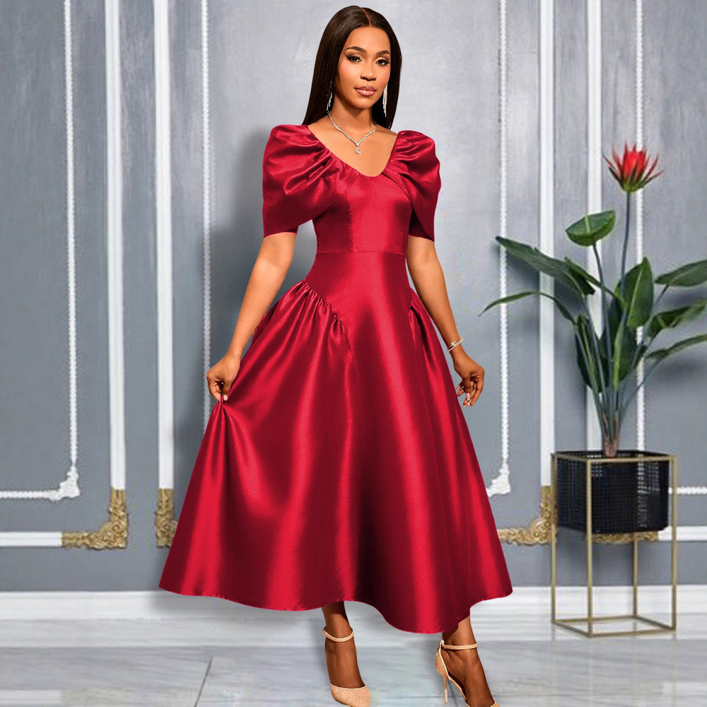 Trendiges Midikleid für Damen, mit auffälligen, voluminösen Puffärmeln und schwingendem Rock für Party.