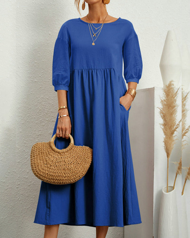 Damen Midikleid Selina mit Laternenärmeln, elegant kombiniert für einen schicken Auftritt am Tag.