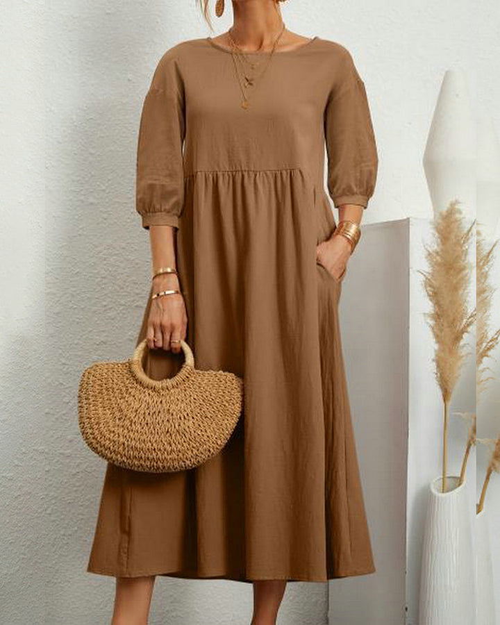 Damen Midikleid Selina mit Rundhalsausschnitt und Laternenärmeln auf Bügel, bereit für Frühling/Herbst.