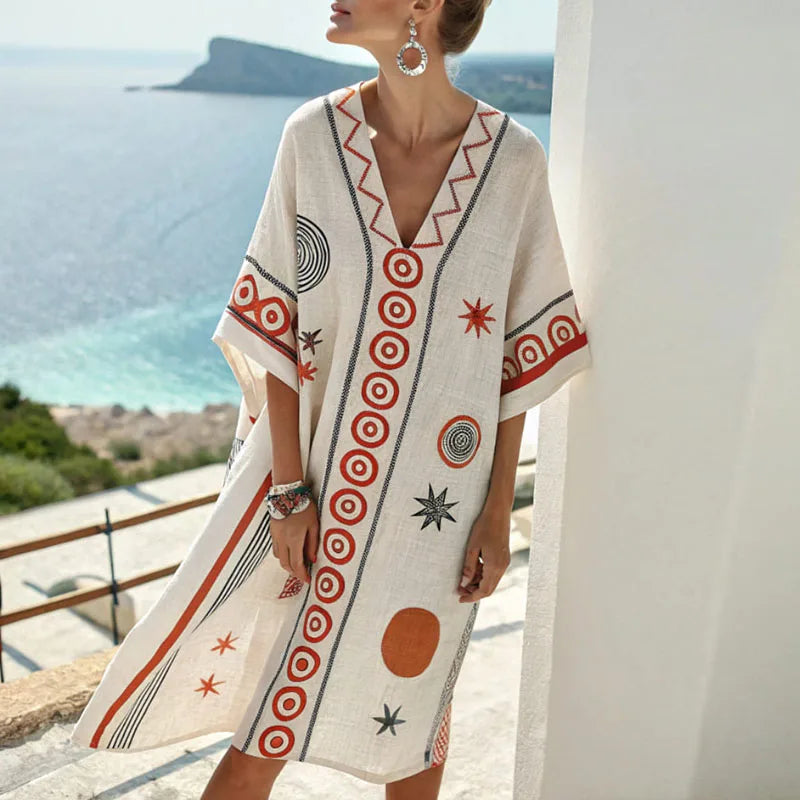 Elegantes Damen Minikleid: Schwarzes Strandkleid mit orangem Blumenmuster. Perfekt als Sommer- oder Freizeitkleid.