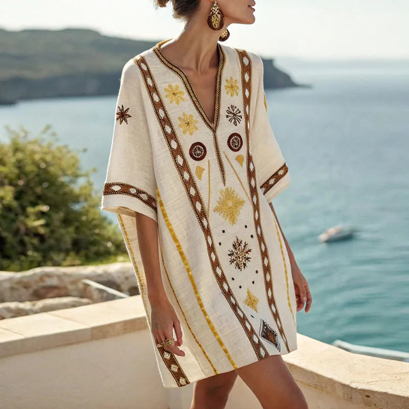 Elegantes Damen Sommer Minikleid mit V-Ausschnitt, floralem Muster in Gelb-Braun, ideal als Strand- oder Freizeitkleid.