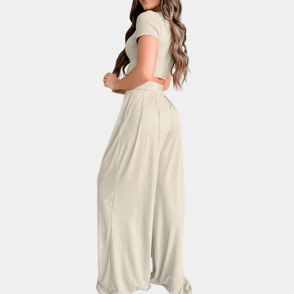 Rückenansicht des Damen Zweiteiler Sets: fließende High-Waist Hose und leichtes Sommer-Top. Eleganz von hinten.