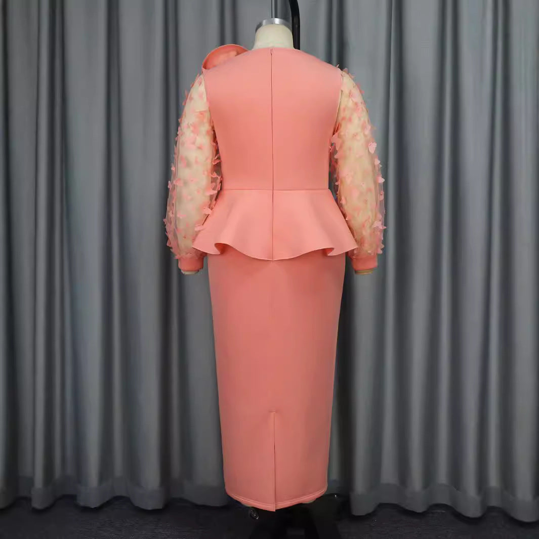 Damen Statement-Kleid mit auffälligen Puffärmeln und detailliertem floralen Muster, perfekt für Frühling/Sommer.