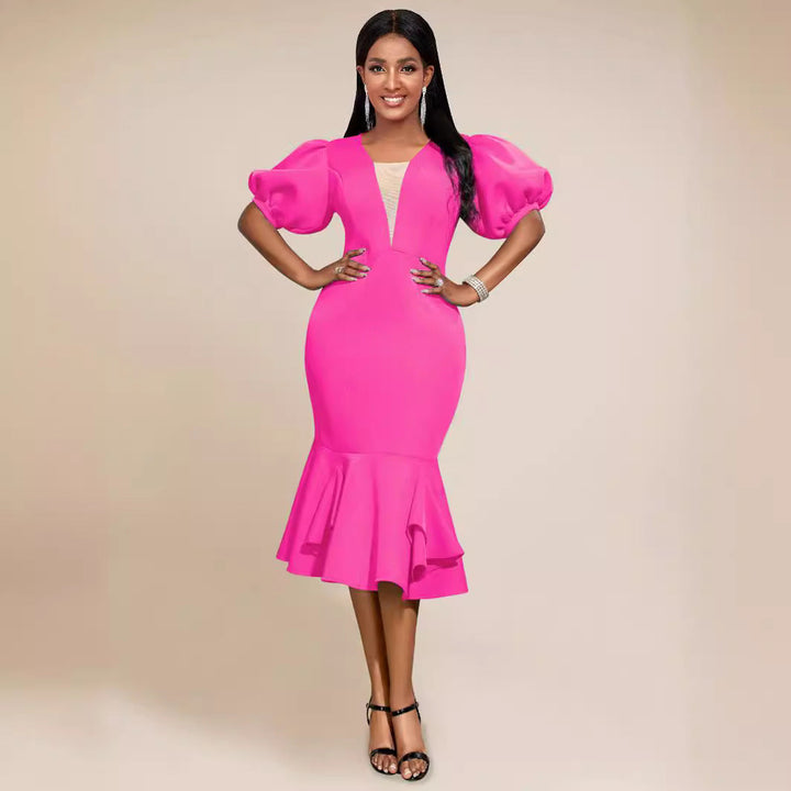 Elegantes, figurbetontes Damenkleid mit Puffärmeln und Rüschensaum für festliche Anlässe und Partys.