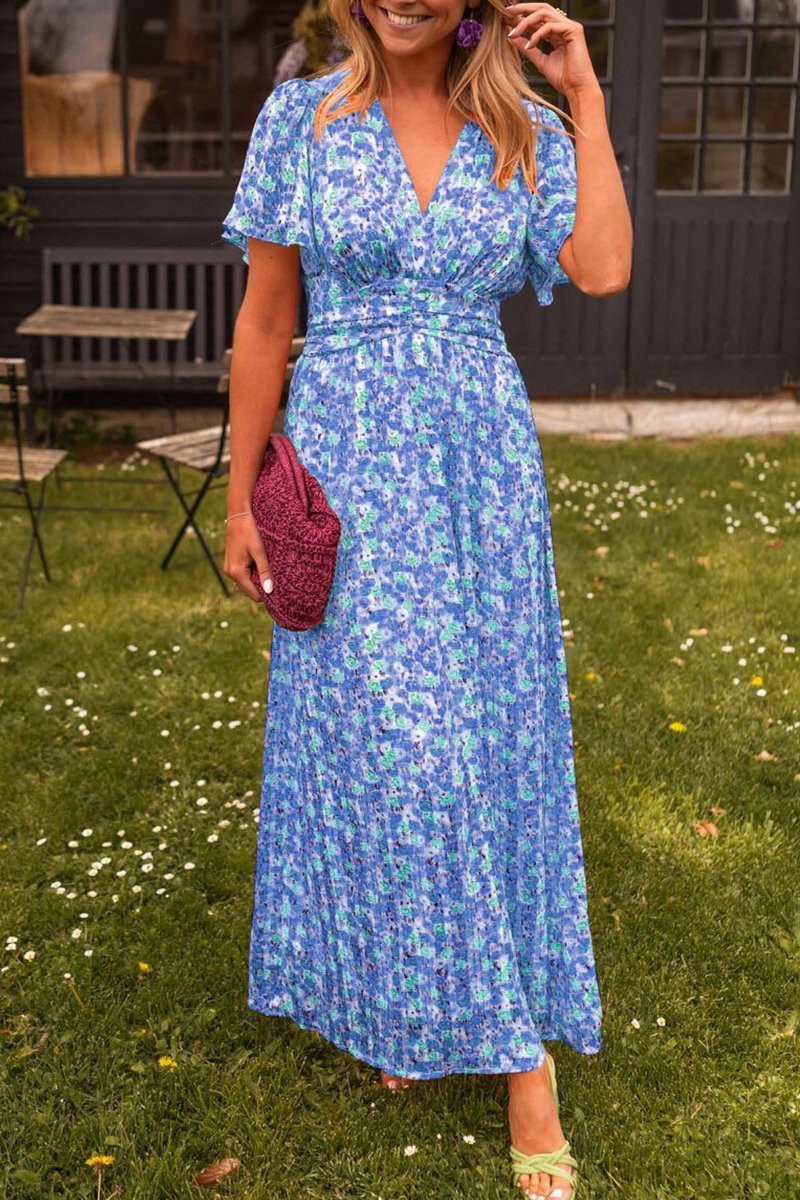 Langes Damen Maxikleid Lyra mit lebhaftem Blumenmuster. Perfektes Boho Sommerkleid für stilvolle Auftritte.