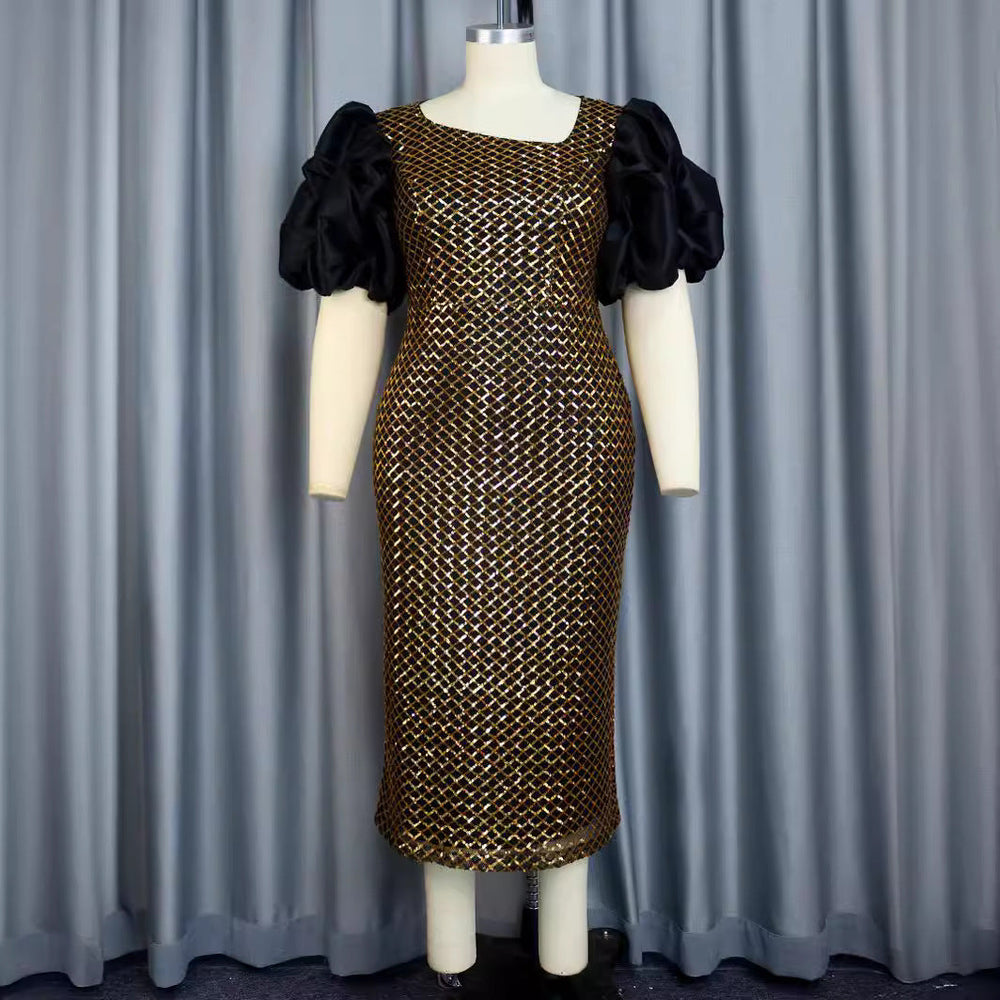 Glamouröses goldenes Partykleid für Damen mit glitzerndem Netzstoff und Puffärmeln; perfekt für festliche Abende.