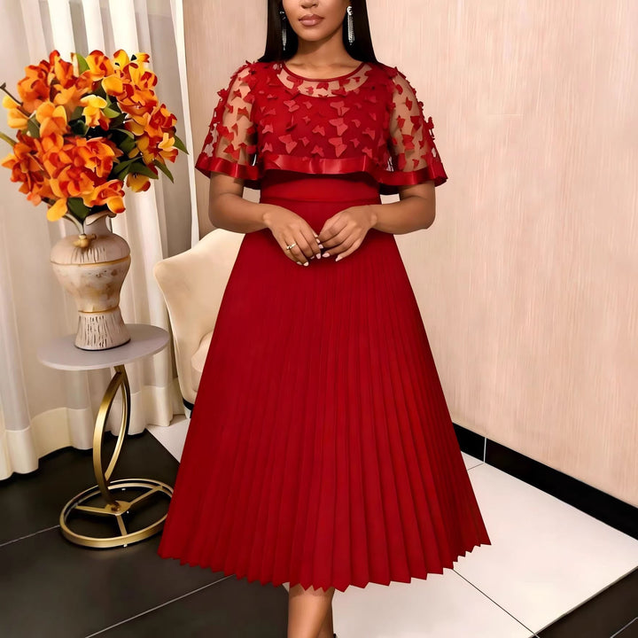 Elegantes rotes Damen Abendkleid mit Plissee-Rock und transparenten Puffärmeln für festliche Anlässe.