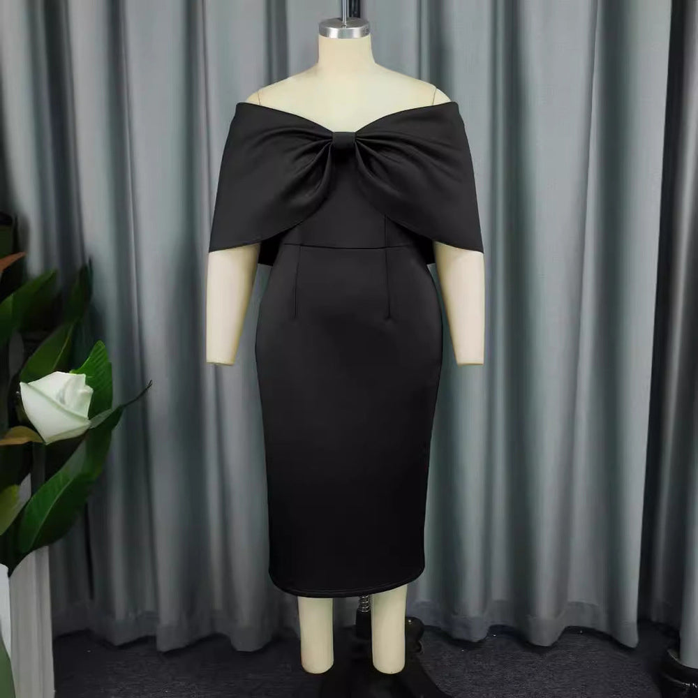 Schwarzes Off-Shoulder Cocktailkleid für Damen mit stylischer Schleife. Ideal als Abend- oder Partykleid.