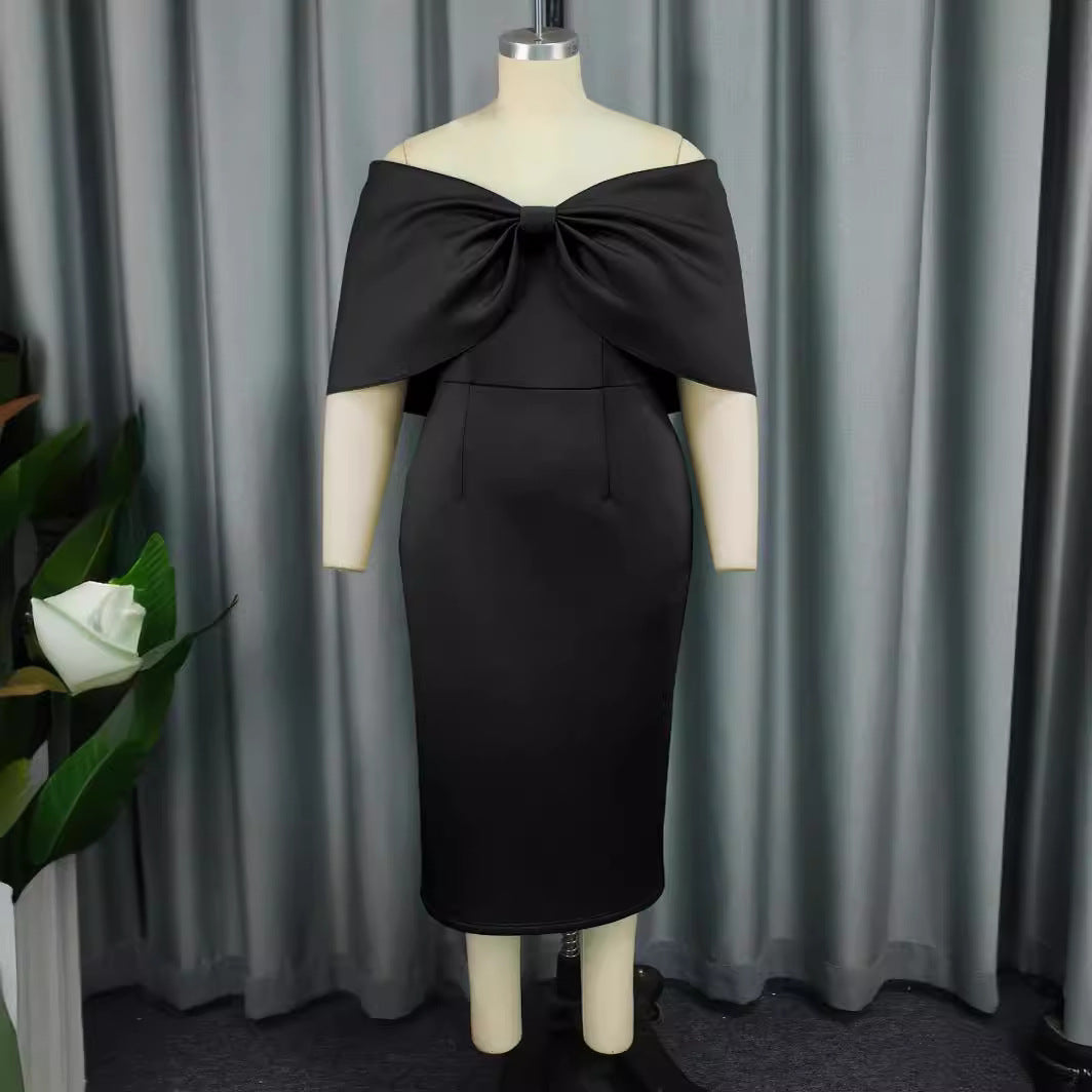 Schwarzes Off-Shoulder Cocktailkleid für Damen mit stylischer Schleife. Ideal als Abend- oder Partykleid.