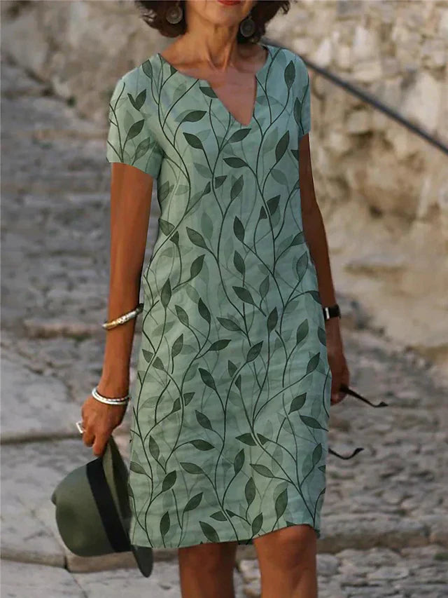 Elegantes smaragdgrünes Damen Midi Kleid mit V-Ausschnitt und modischem Musterdesign, perfekt für den Sommer.