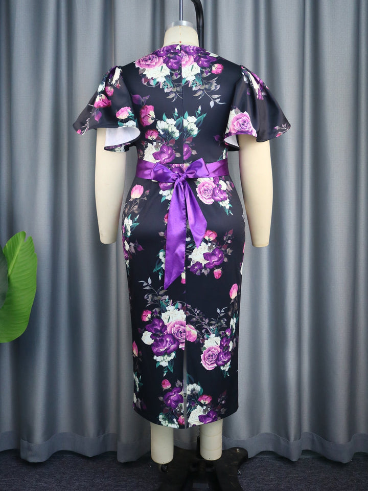 Modisches Damen-Partykleid, figurbetont, mit floralem Design und stylischen Puffärmeln für einen eleganten Look.