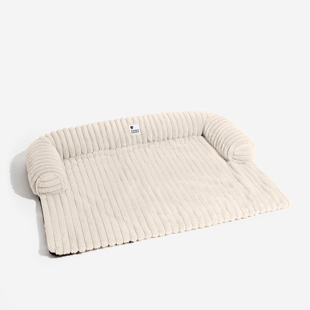 Flauschiges Kuschelbett für Hunde mit erhöhten Rändern, ideal als Sofaschutz für alle Rassen.
