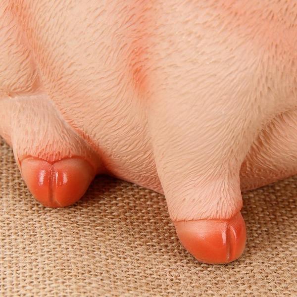 Charmante Sparbüchse, bruchfeste Tierfigur aus Naturharz. Perfekt als Geschenk oder Deko im Kinderzimmer.