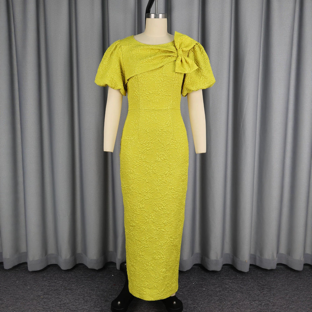 Stilvolles gelbes Maxikleid für Damen mit Puffärmeln & Schleife. Ideal als Abend- oder Anlasskleid, elegant & lang.