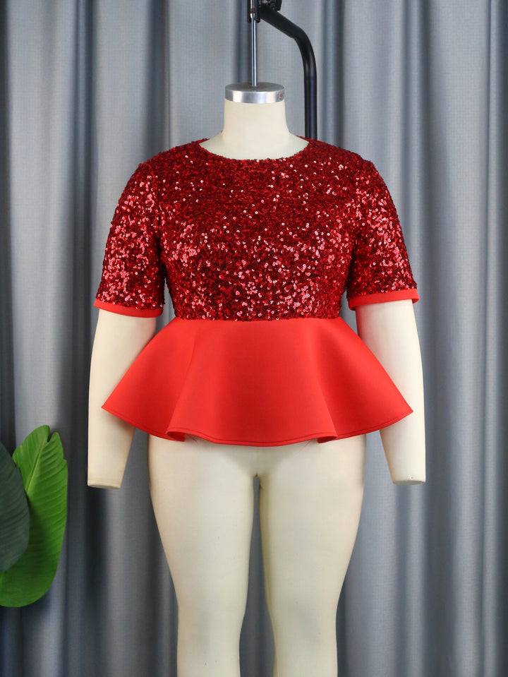 Edles Damen Glitzer Peplum-Oberteil mit funkelnden Pailletten. Ein Kurzarm-Top für stilvolle Abendgarderobe.