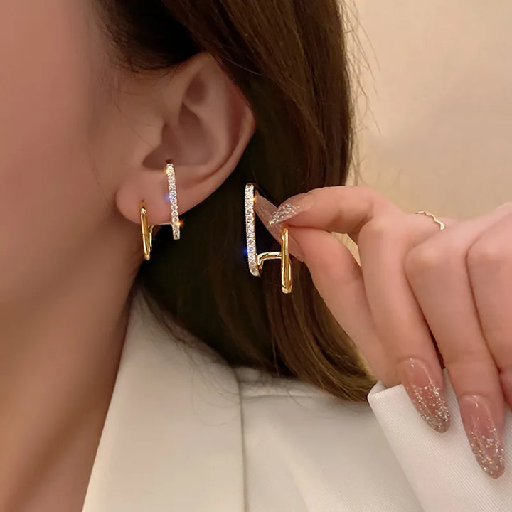 Stylische Damen Ohrringe: Funkelnde Kristallkrallen-Ohrstecker für einen glamourösen Illusion-Look.