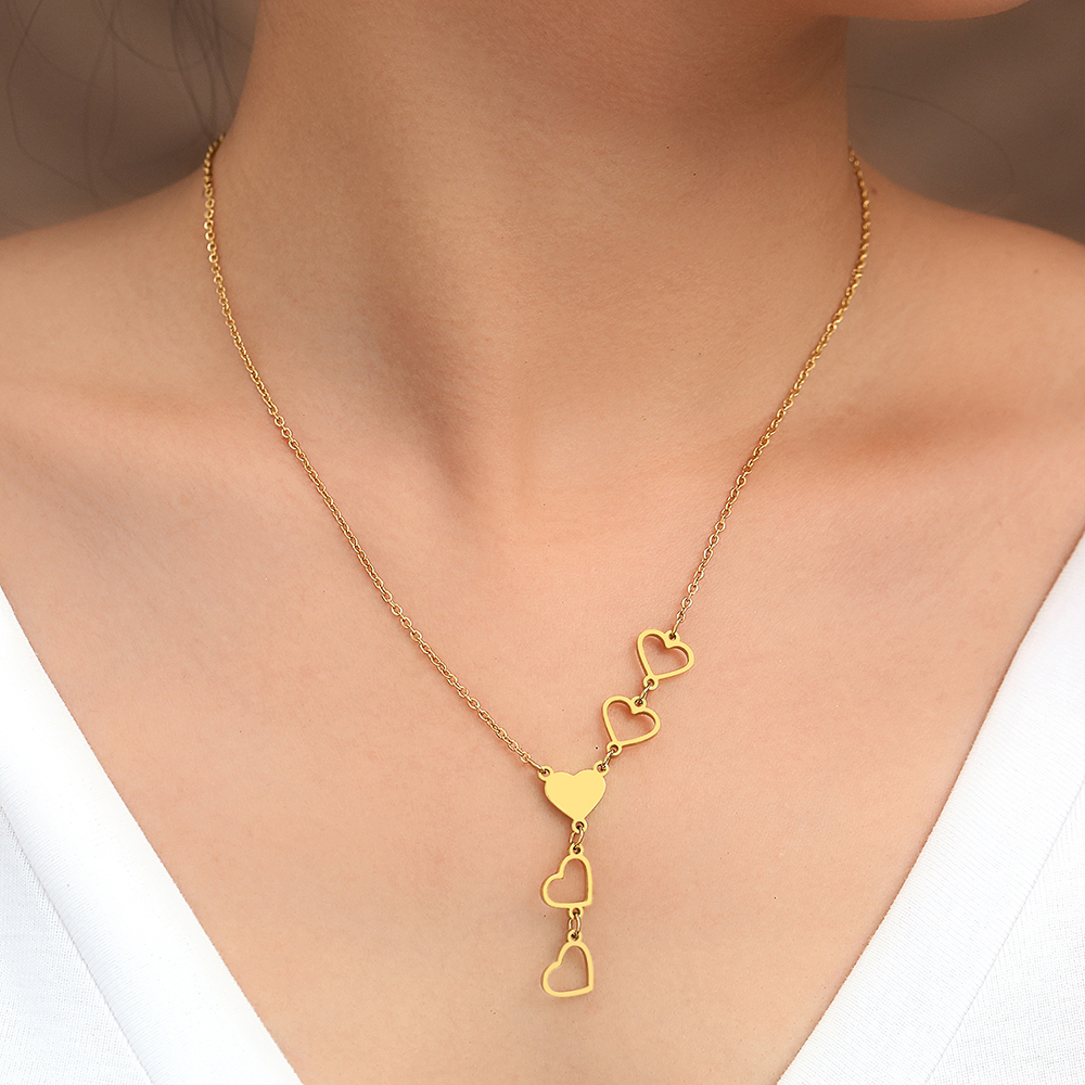 Modische Damen Halskette: Zwei elegante, verbundene Herzen in strahlendem Gold & Silber. Perfektes Accessoire.