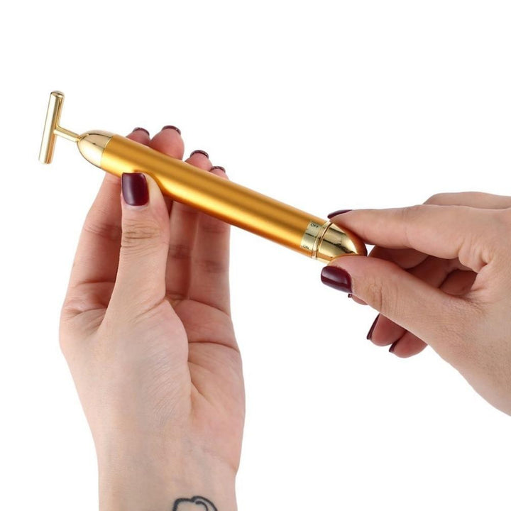 Goldener T-Bar zur Hautverjüngung: Vibrationsmassager für ein frisches, strahlendes Aussehen.