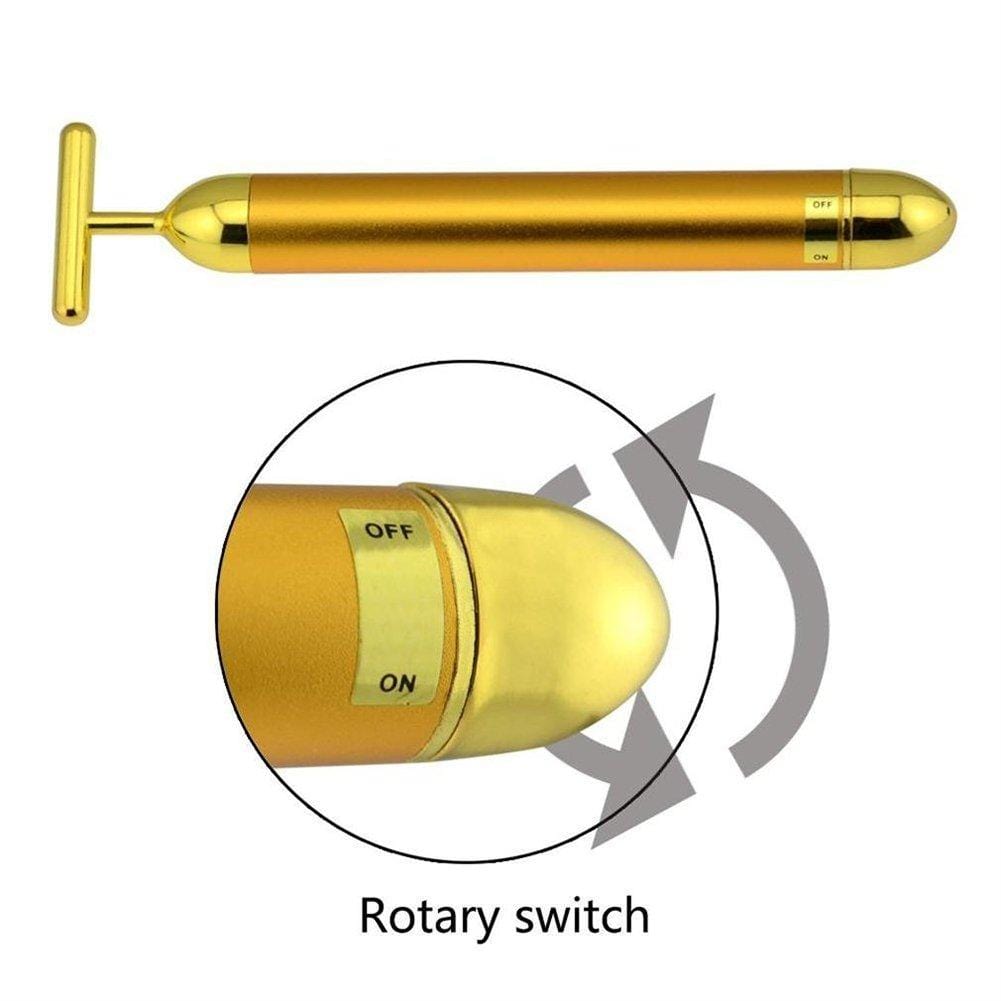 Beauty-Tool: Goldener T-Bar Gesichtsmassager mit Vibration für Anti-Aging & Hautstraffung.