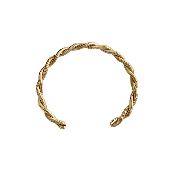 Stilvolles Damen Manschettenarmband mit Twist-Design aus Edelstahl, erhältlich in Gold oder Silber.
