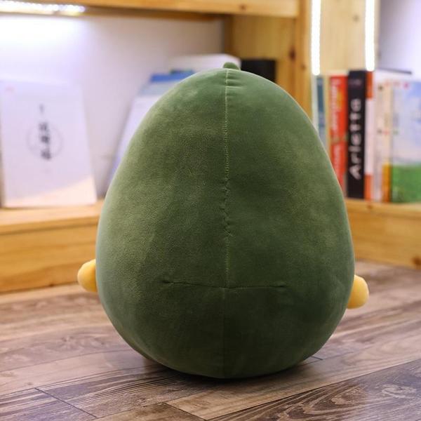 Grünes Avocado Plüschkissen, gleichzeitig Stofftier und stylisches Dekokissen für Wohn- oder Kinderzimmer.