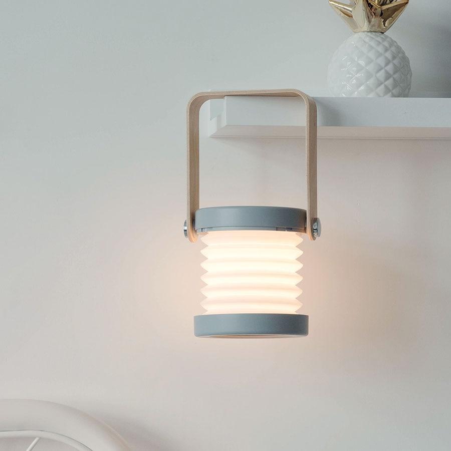 Elegante faltbare LED-Tischlampe in Weiß, dimmbar warmweiß, dekorative Beleuchtung für gemütliche Wohnräume.