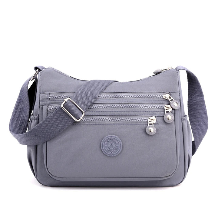 Organisierte Damen Messenger Bag in modernem Design. Stilvolle Umhängetasche für Damenmode & Alltag.