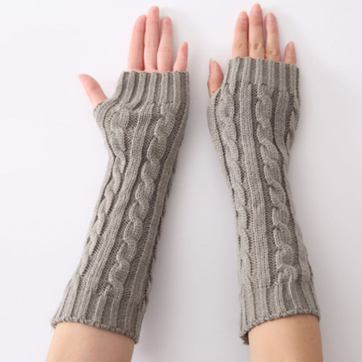 Hochwertige, fingerlose Damen-Handschuhe, in Langform, spenden Wärme und sind ein modisches Statement im Herbst.