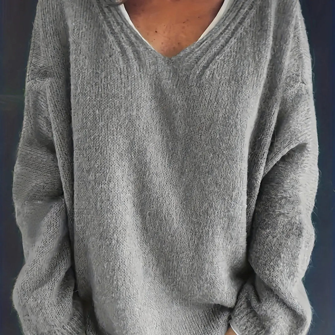 Lässiger Plus Size Longpullover mit V-Ausschnitt für Damen. Modische Strickware, sehr komfortabel.