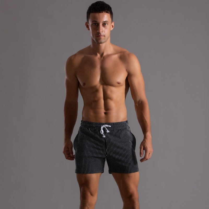 Schnelltrocknende Bademode Herren, grau, slim fit, perfekt für Pool und Freizeit.