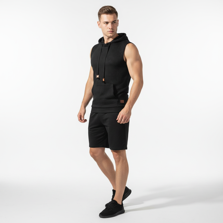 Atmungsaktives Herren Tanktop mit Kapuze, feuchtigkeitsableitend für intensive Workouts.