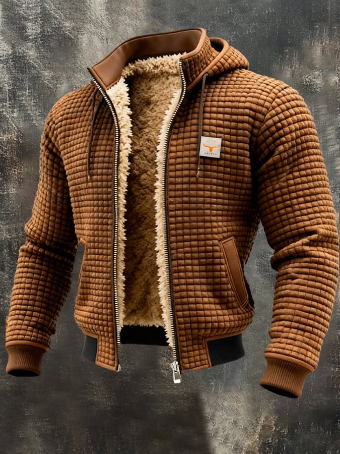 Nahaufnahme der strukturierten Oberfläche der winddichten Thermo Impact Herren Winterjacke. Kälteschutz.