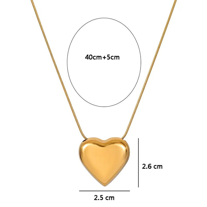 Elegante Herzkette in Goldoptik mit Pfirsich Herz Anhänger, ein exquisites Accessoire für Damen.